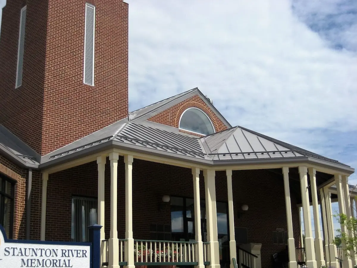 Skilled roofing craftsmen working on a residential roof in Waynesville